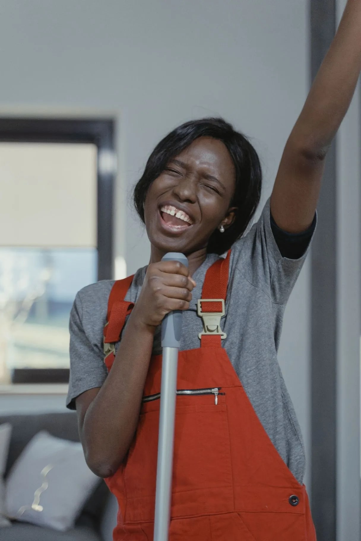 Woman laughing while mopping